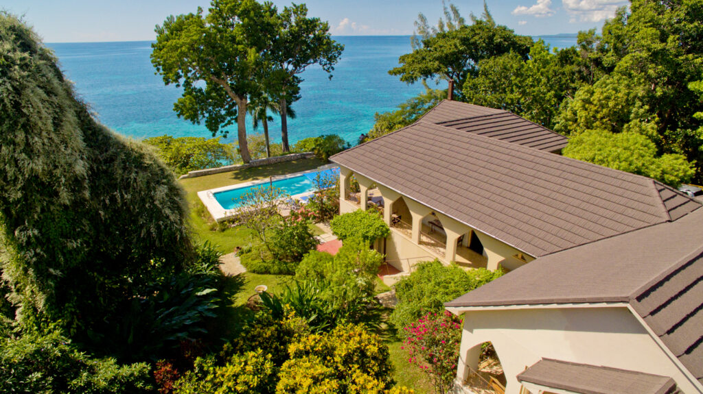 Shows a seaside villa at a psilocybin retreat