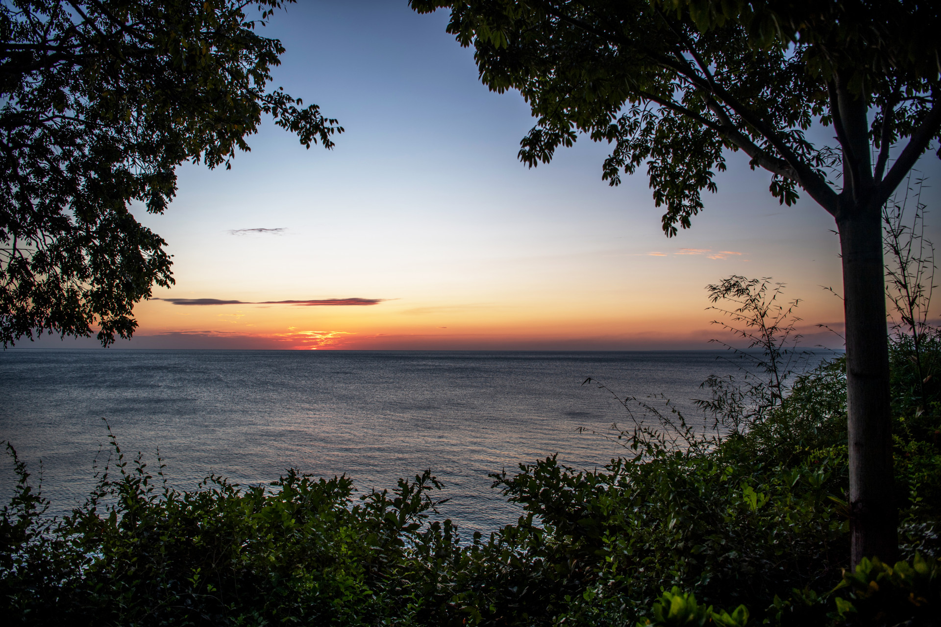 Sunset from the beach of a MycoMeditations psychedelic retreat for end-of-life distress