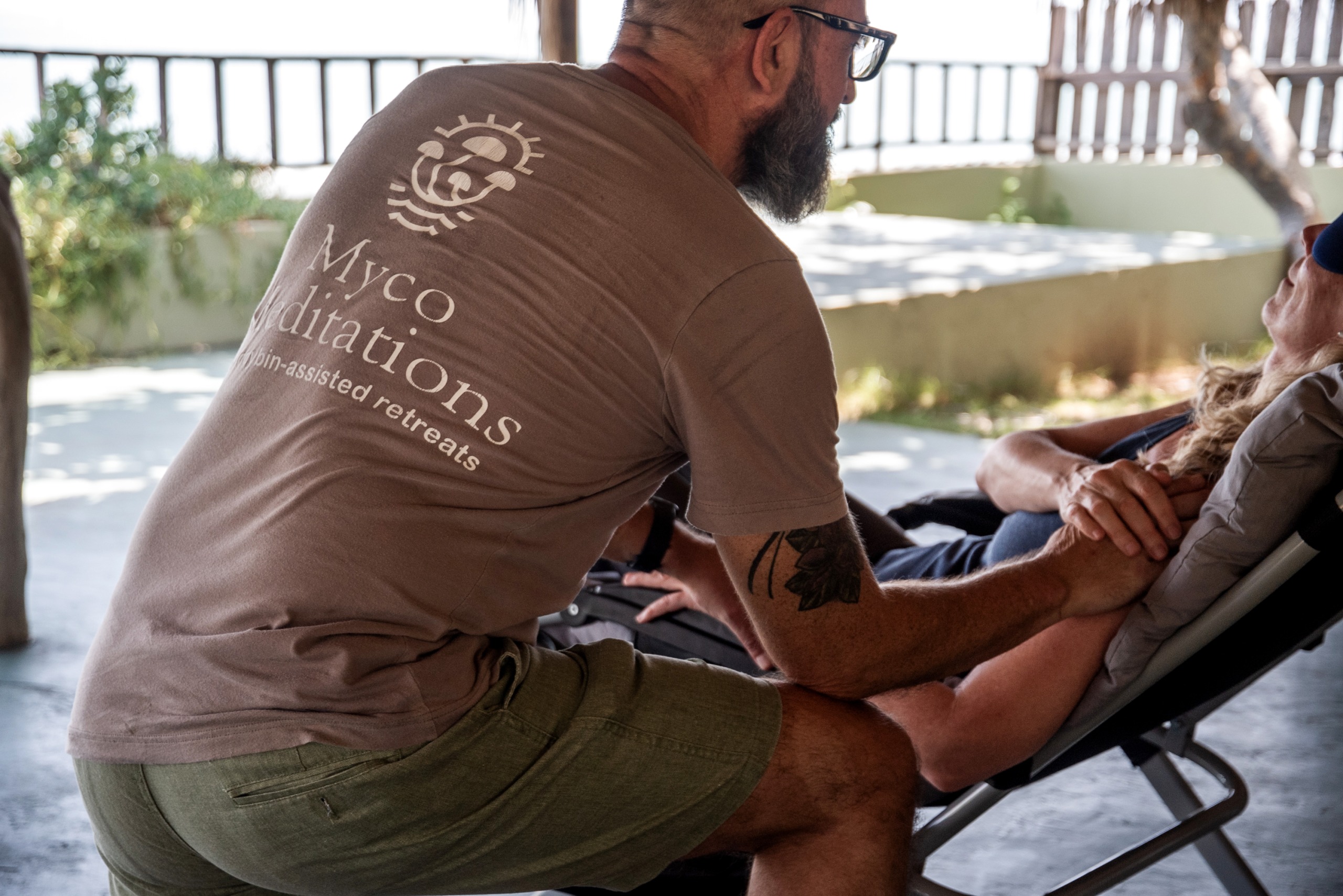 ceo and head facilitator of mycomeditations justin townsend guiding a client through a psilocybin therapy session