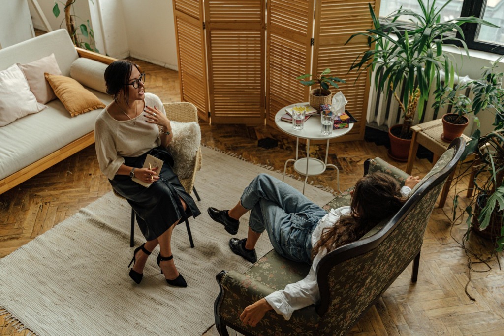 A psychotherapist talking to a client during a therapy session