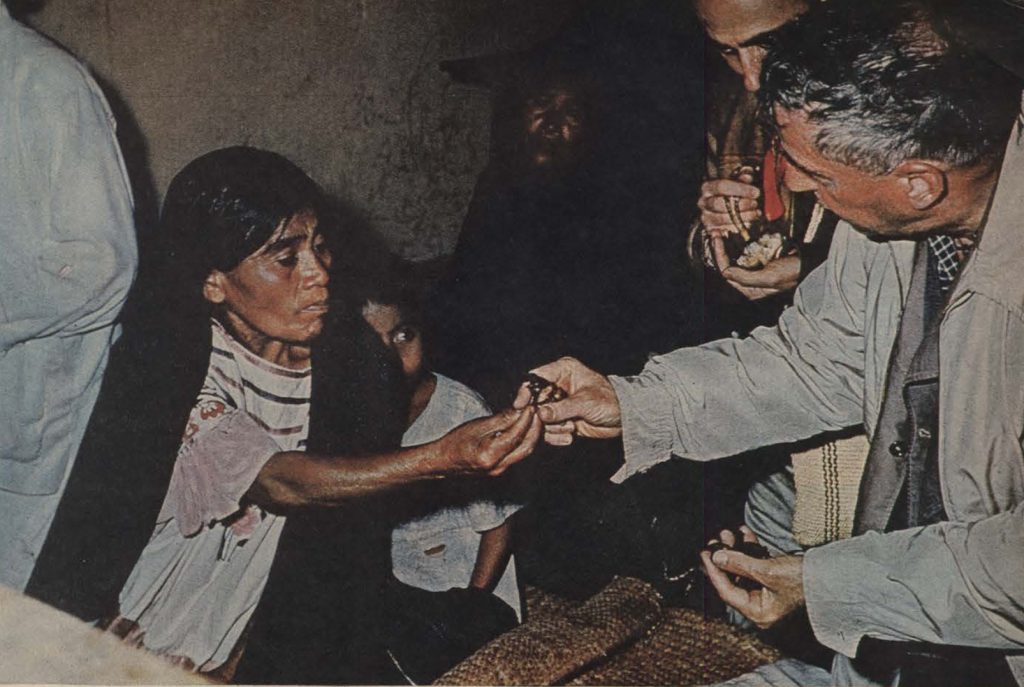 R. Gordon Wasson taking a psilocybin mushroom from Maria Sabina.