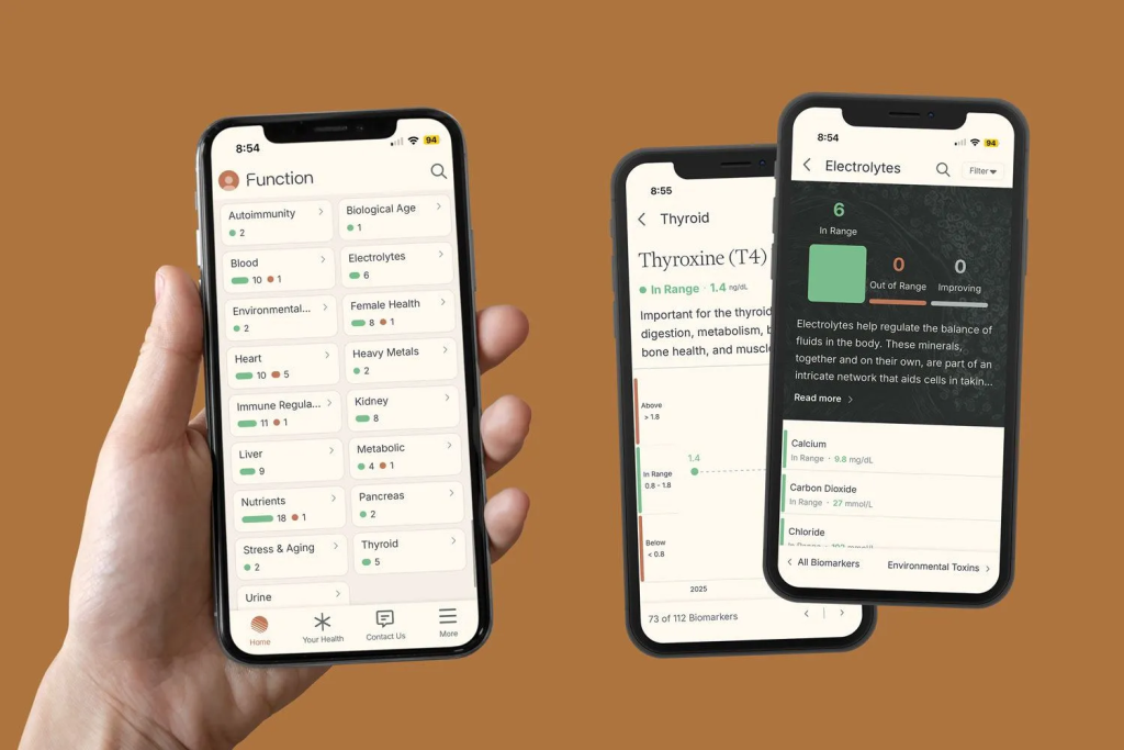 Phones showing biomarker lab results with hand holding one phone